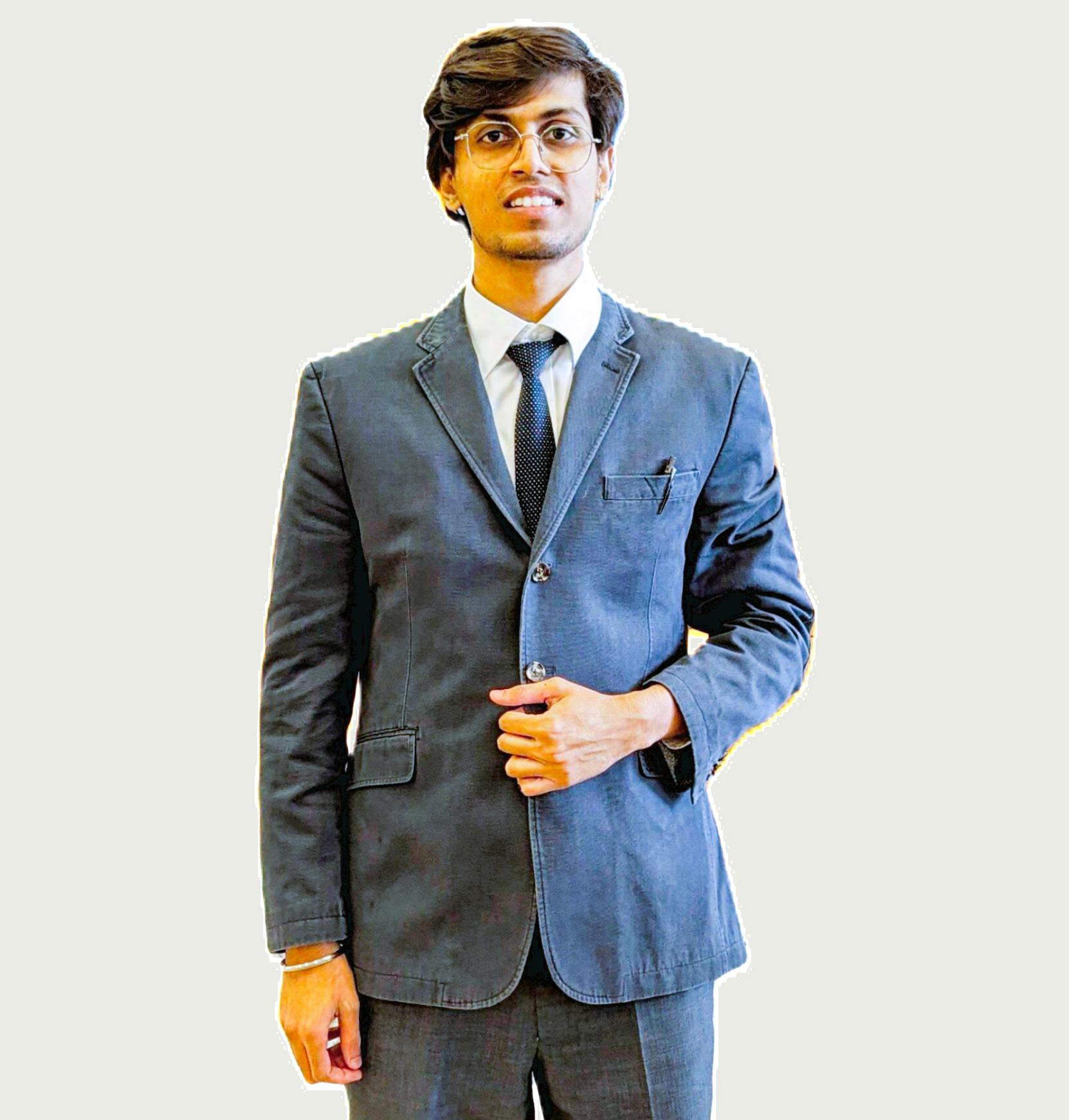 A professional portrait of Shivam Jadhav