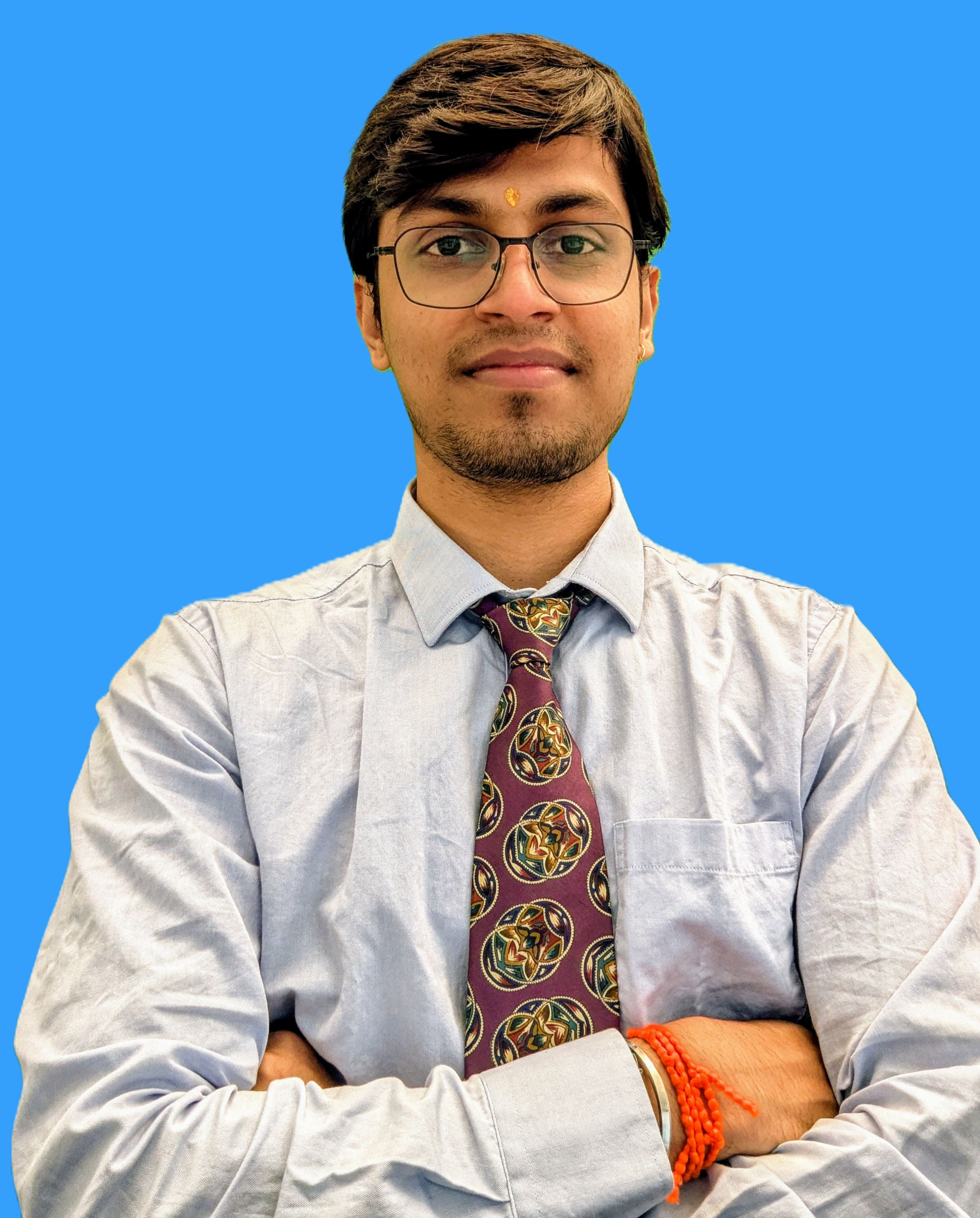 A professional portrait of Shivam Jadhav